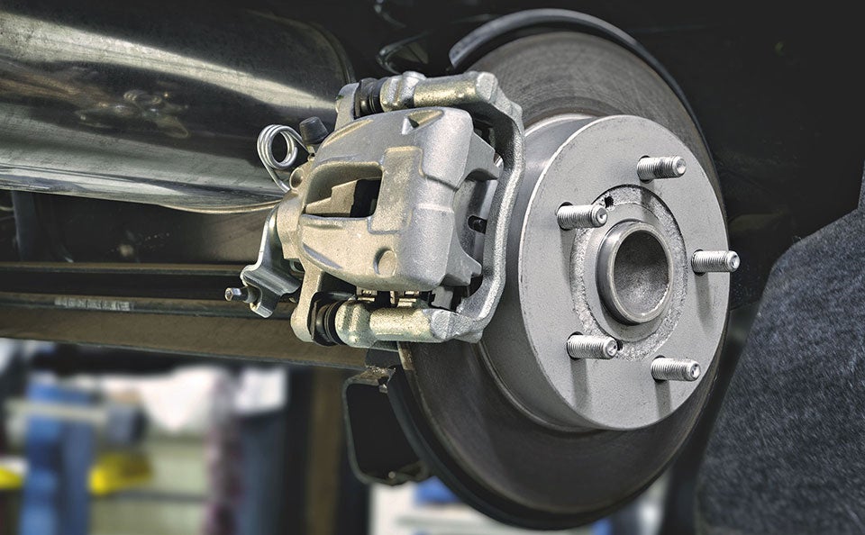 A picture of new brakes installed on a car, before the wheel goes back on.